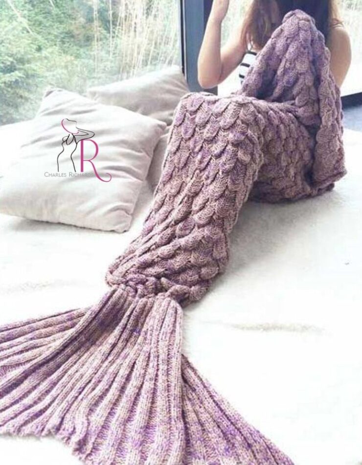 this is an image of a large crocheted mermaid blanket