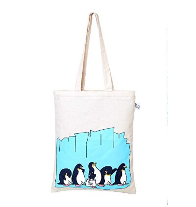 This is an image of a white tote bag with penguin print. 