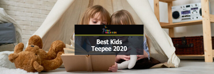 photo of kids reading a book inside a teepee