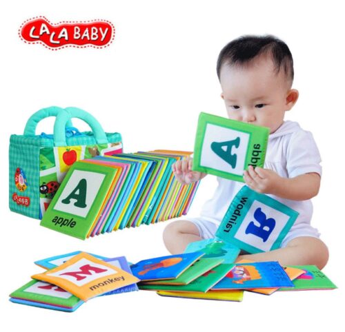 this is an image of a toddler playing with 26 letters cloth card.