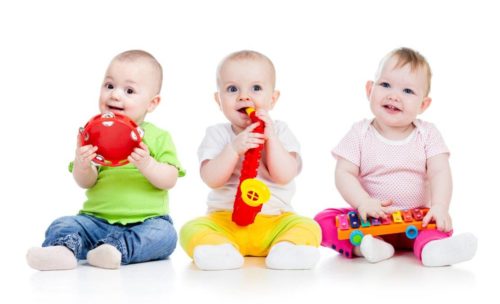 3 toddlers playing music