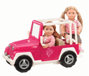 2 girl doll figures inside a small doll car