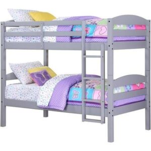 Twin bunk bed with children's toys surrounding 