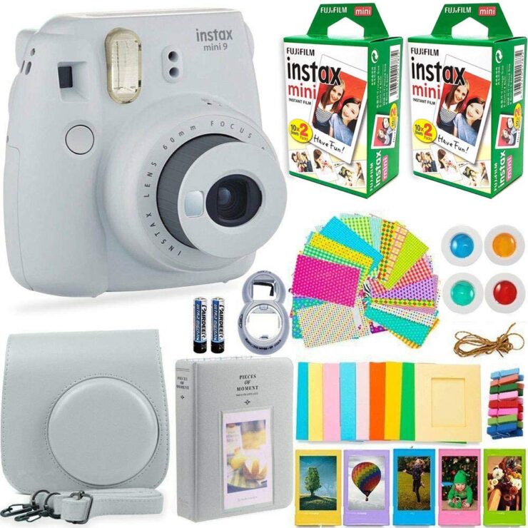 A picture of an Instax mini in white color with extra films, carry bag, and other accessories.