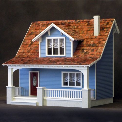 blue dollhouse with red roof and chimney