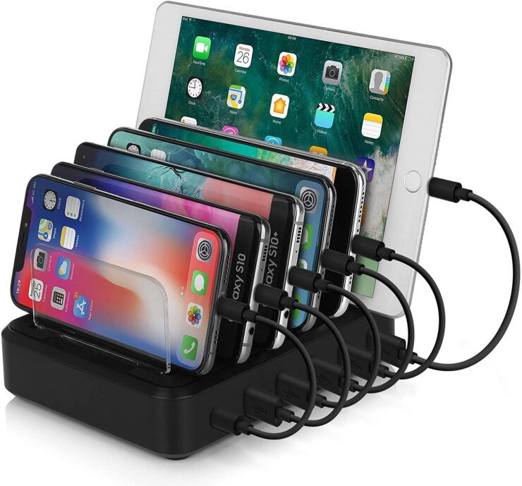 this is an image of a charging station with five phones charging and one iPad