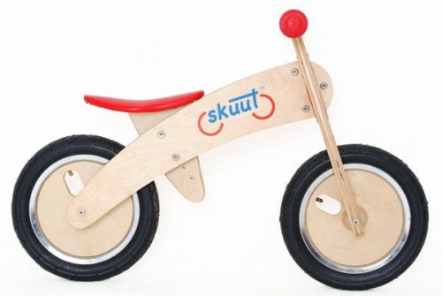 Diggin Active Skuut Wooden Balance Bike being rode by a little boy
