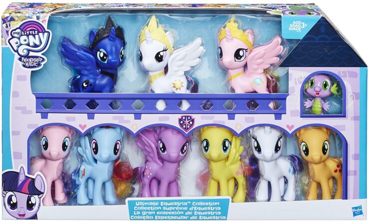 An image of Little ponies in a box with a house.