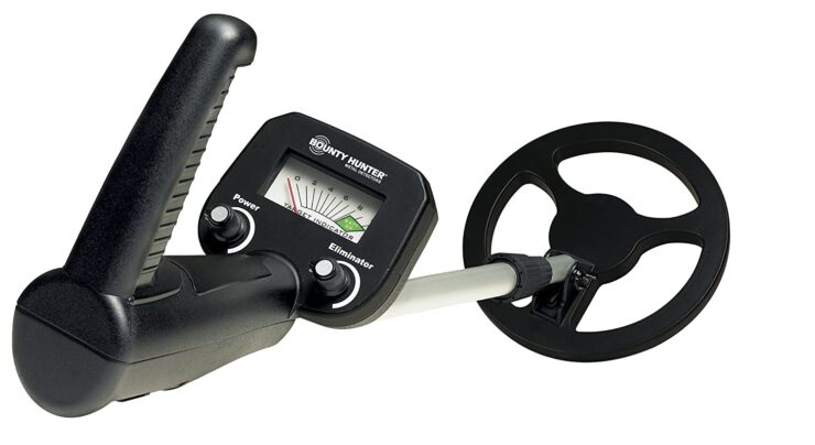 A metal detector with dial, in color black.