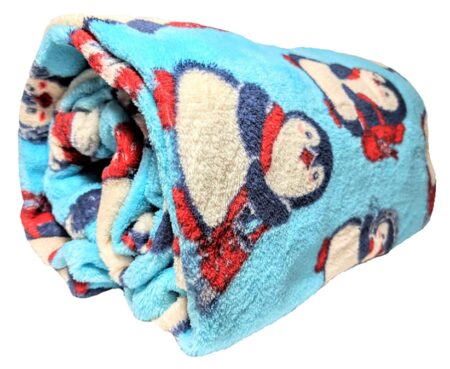 This is an image of a throw blanket with penguin prints. 