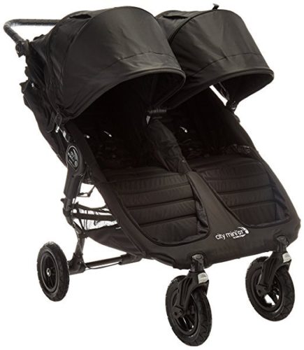 this is an image of a black side by side double stroller for babies. 