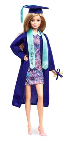 This is an image of a barbie doll wearing a graduation dress, gown and cap with tassel. 