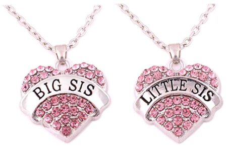 This is an image of girl's crystal heart necklaces set in pink color
