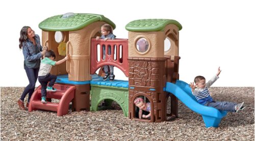 This is an image of four children playing with Step2 Clubhouse Climber