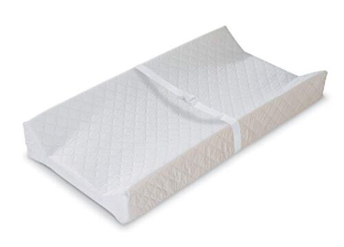 this is an image of a contoured changing pad for babies. 