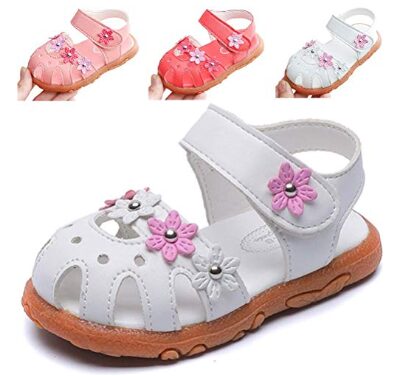 this is an image of a girls closed toe sandal with flower design. 