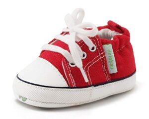 this is an image of a red soft soled canvas shoes for babies. 