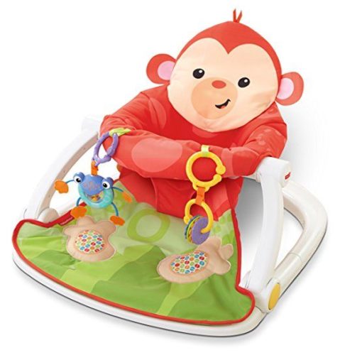 A child in a Sit Me Up monkey Infant Floor Seat