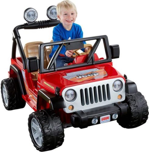 Toddler in a 12v red jeep wrangler 