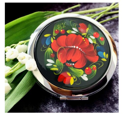 this is an image of a floral design compact mirror for teenage girls. 