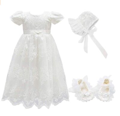 This is an image of an off white christening dress set for baby girls. 