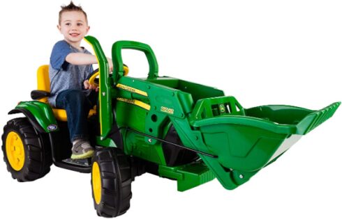 This is an image of Ground Loader Ride On toy with boy riding