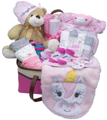 This is an image of newborn girl's basket gift with multiple items in white and pink colors