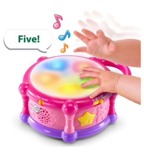 this is an image of a pink learn & groove color play drum for ages 7 month old. 