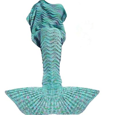 This is an image of a mint green mermaid tail blanket. 