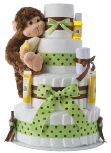 this is an image of a diaper cake in monkey theme for baby boys.