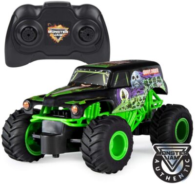 This is an image of monster car with remote control in green and black color with remote control