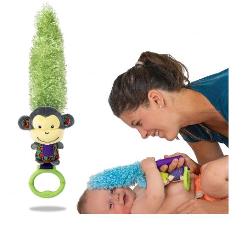 this is an image of a mom using a multi-purpose monkey toy for her baby. 