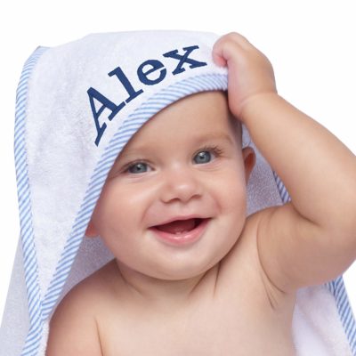 This is an image of a baby wearing a personalized hooded bath towel. 