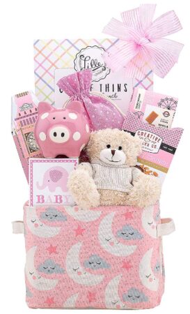 This is an image of baby girl basket gift with various of toys and items in pink color
