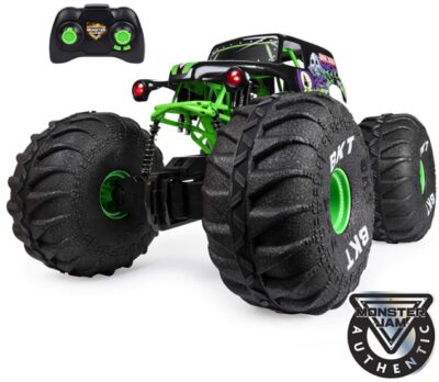 This is an image of remote control monster truck in black and green colors with remote control