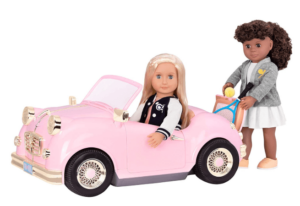 Retro doll car with 2 dolls, one inside and the other outside the pink car
