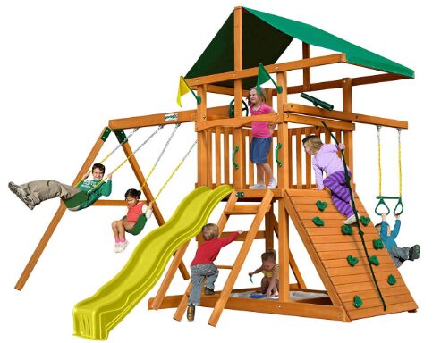 This is an image of Outing Play and SwingSets with Wave Slide, Two Swings, Rock Climbing Wall, Ring/Trapeze Bar, Sandbox, Covered Play Fort and Climbing Rope, From By Swing-N-Slide