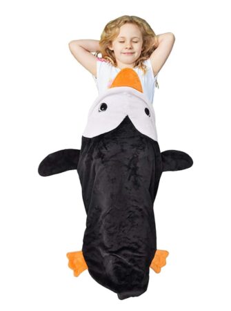 This is an image of a little girl wearing a black penguin blanket bag.