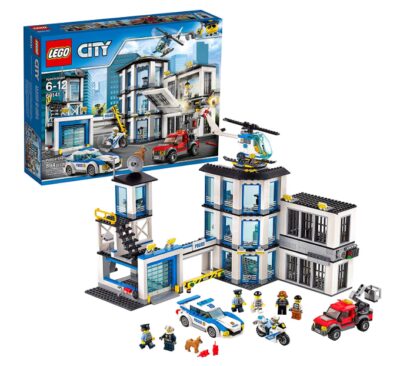 This is an image of a police station set with mini figures and toy vehicles. 