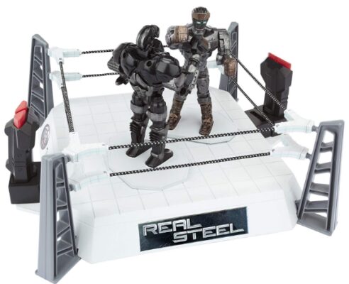 This is an image of 2 toy robots fighting in an arena 
