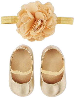 This is an image of girl's shoes and headband gift box set in golden color