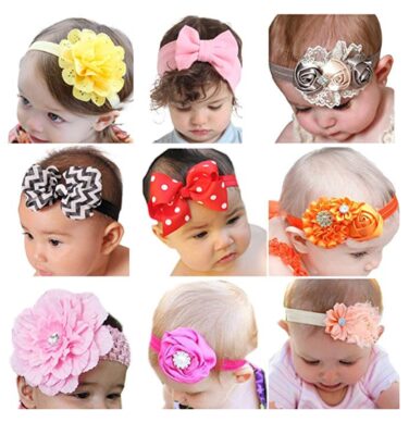 this is an image of a 9 baby girls wearing cute hair bows. 