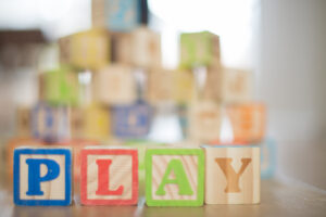 this is an image of wooden building blocks spelling play