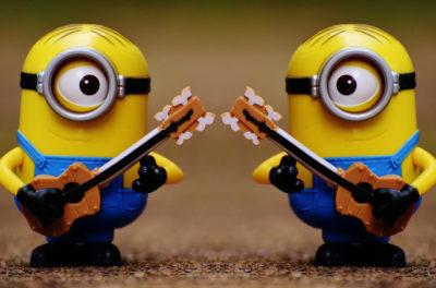 this is an image of two minions with guitars