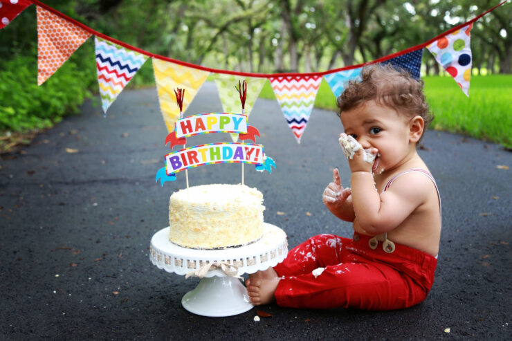 this is an image of a boy having a cake smash