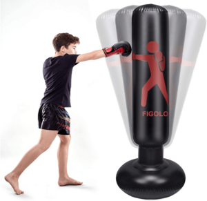 image of a kid punching an inflatable punching bag 