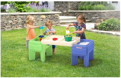  this is an image of an indoor and outdoor sand and water activity table with 4 cup holders for kids. 