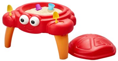 this is an image of a Crabbie sand table with removable shell lid and 4-piece accessory set designed for kids. 