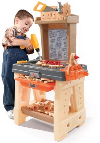 This is an image of Step2 kids Toy Workshop With Tools and a boy using a tool