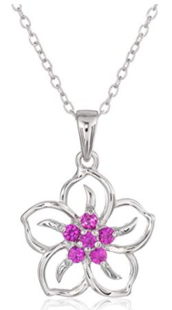 This is an image of girl's silver flower pendant necklace in silver and purple colors